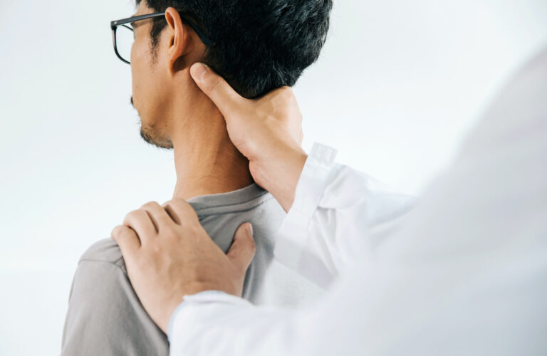 Physiotherapist doing healing treatment on man's neck,Chiropractic adjustment, pain relief concept